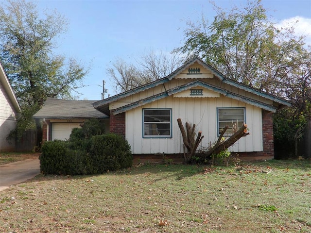 view of home's exterior with a lawn and a garage