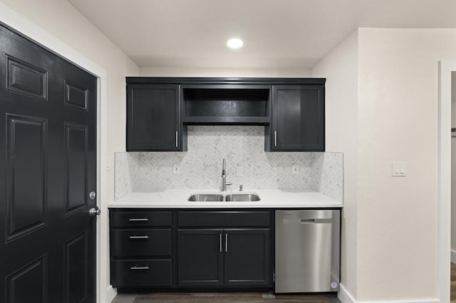 kitchen with dishwasher, backsplash, dark hardwood / wood-style floors, and sink