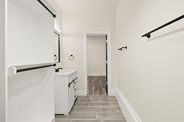 bathroom with hardwood / wood-style floors and vanity