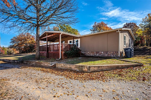 view of side of property with a deck