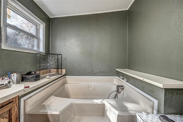 bathroom with a tub to relax in and ornamental molding