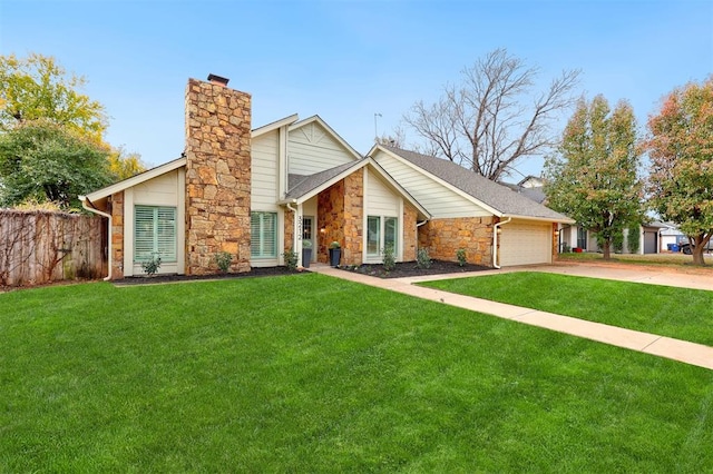 view of front of property with a garage and a front yard