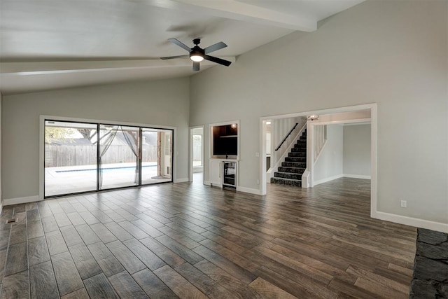 unfurnished living room with beam ceiling, ceiling fan, dark hardwood / wood-style flooring, and high vaulted ceiling