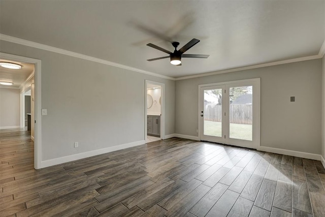 empty room with ceiling fan, dark hardwood / wood-style flooring, and crown molding