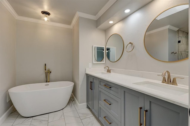 bathroom with a bathing tub, vanity, and ornamental molding