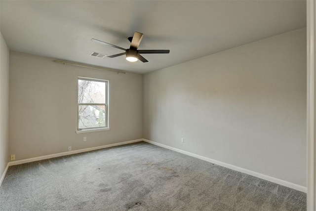 carpeted empty room with ceiling fan