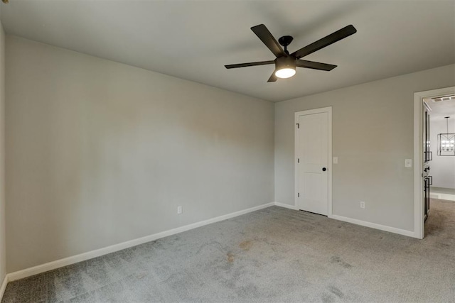 unfurnished room featuring light carpet and ceiling fan