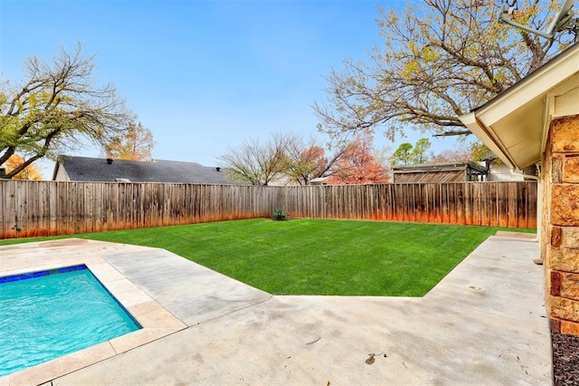 view of yard featuring a fenced in pool and a patio area