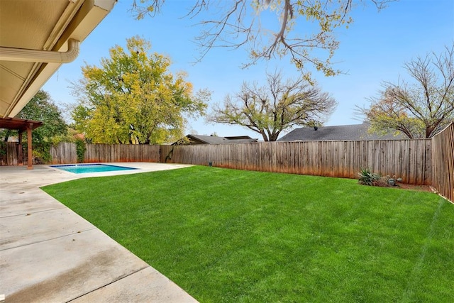 view of yard featuring a fenced in pool and a patio area