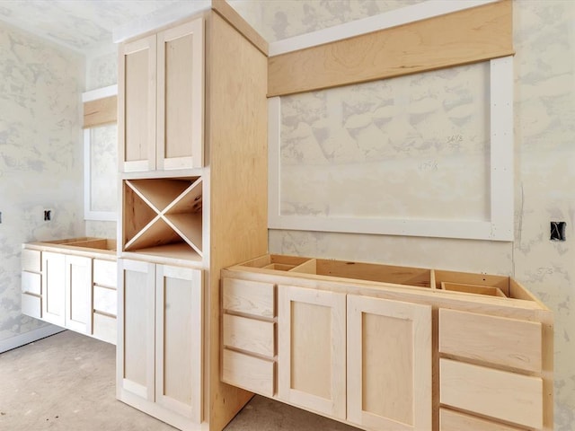 interior space featuring light brown cabinets