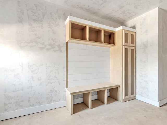 mudroom with concrete flooring