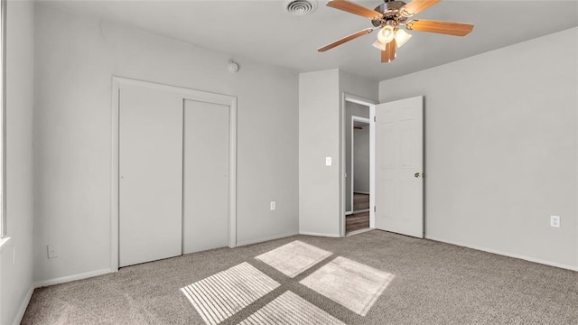 unfurnished bedroom featuring ceiling fan and light carpet