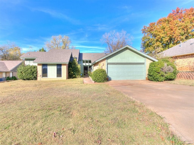 ranch-style house with a garage and a front lawn