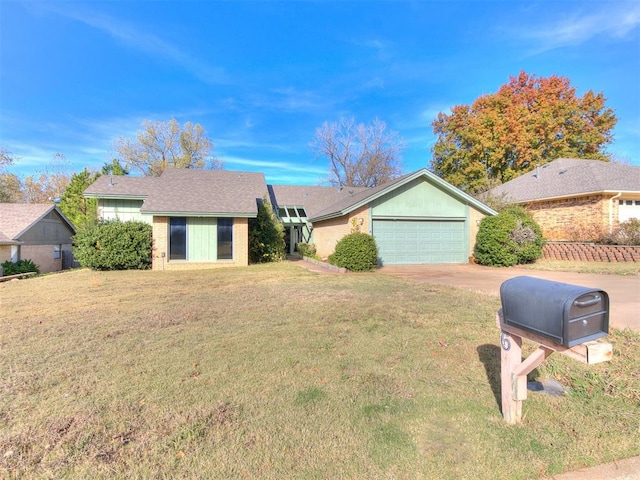 single story home featuring a garage and a front yard