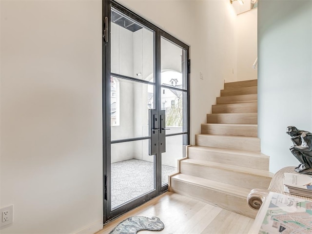 staircase with wood-type flooring