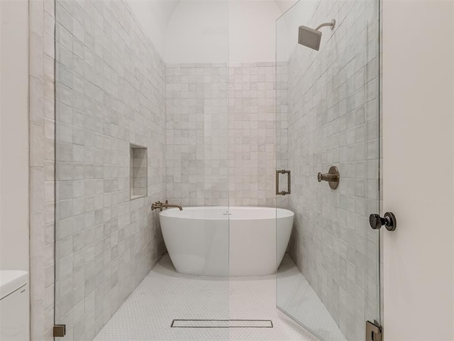 bathroom featuring tile patterned floors, shower with separate bathtub, and tile walls