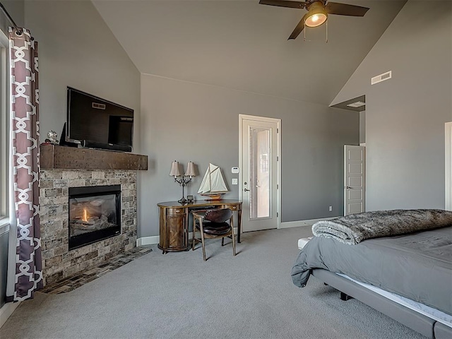 bedroom featuring carpet, high vaulted ceiling, a stone fireplace, and ceiling fan