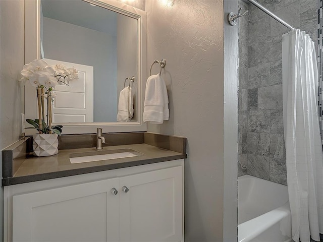 bathroom featuring vanity and shower / tub combo with curtain