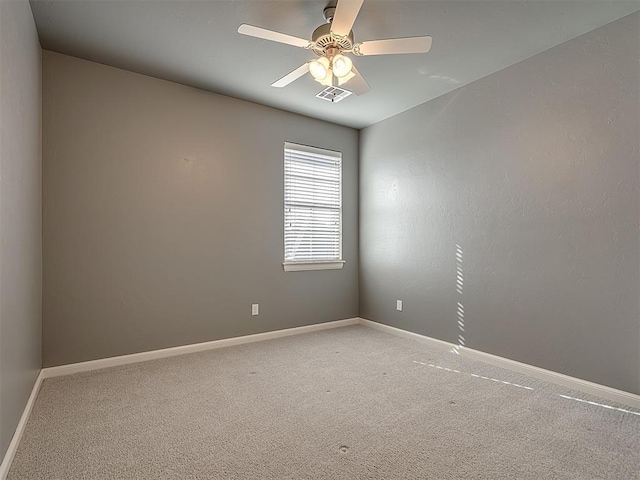 empty room with carpet and ceiling fan