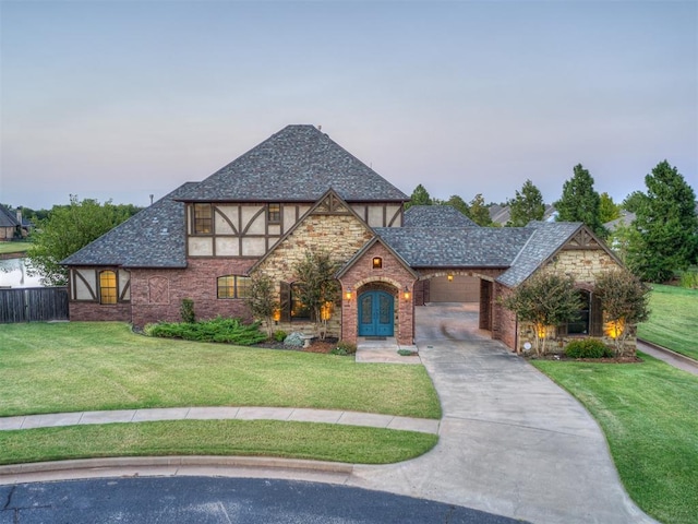 english style home with a lawn and french doors