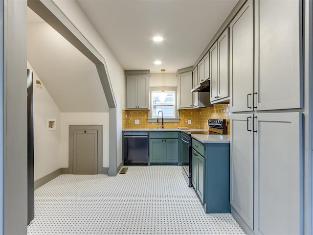 kitchen with pendant lighting, sink, range with electric cooktop, stainless steel dishwasher, and decorative backsplash