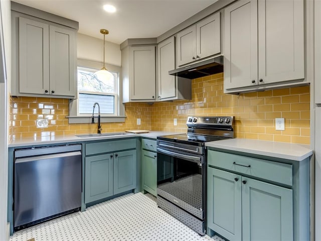 kitchen with sink, stainless steel dishwasher, decorative light fixtures, electric stove, and decorative backsplash