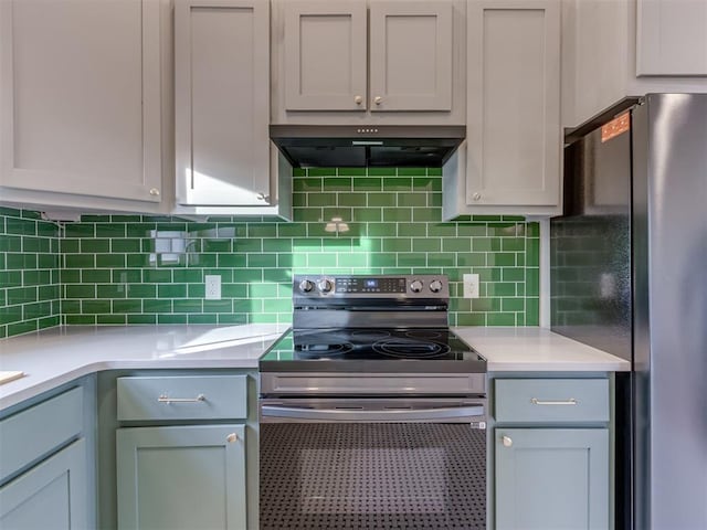 kitchen with tasteful backsplash, ventilation hood, and appliances with stainless steel finishes