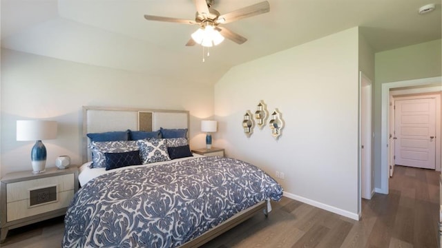 bedroom featuring vaulted ceiling, dark wood-style flooring, a ceiling fan, and baseboards