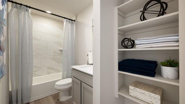 bathroom with toilet, shower / bath combo, wood finished floors, and vanity