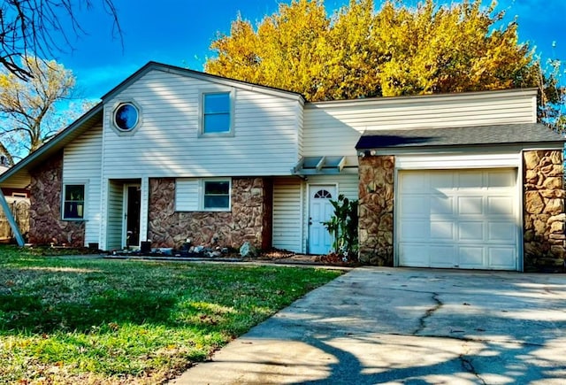 view of front of house with a garage and a front yard