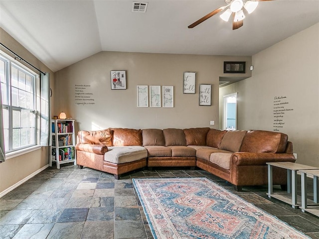 living room featuring ceiling fan and lofted ceiling