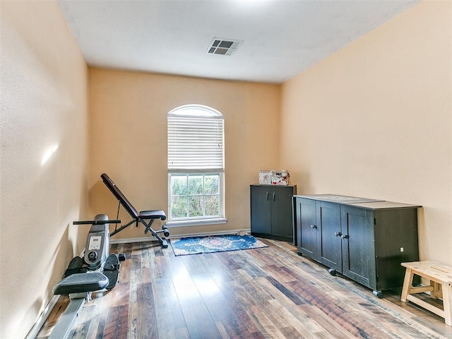 exercise area featuring hardwood / wood-style flooring