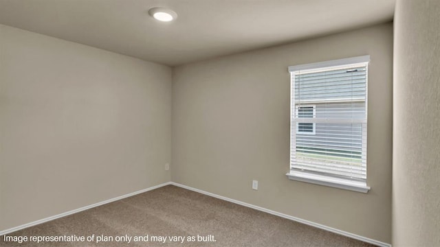 unfurnished room featuring baseboards and light colored carpet