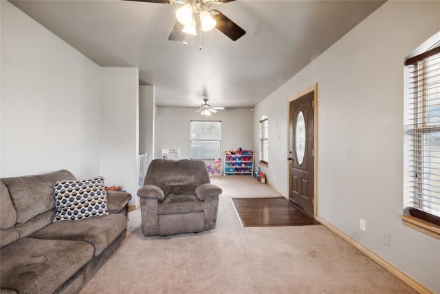 living room featuring carpet, a wealth of natural light, and ceiling fan