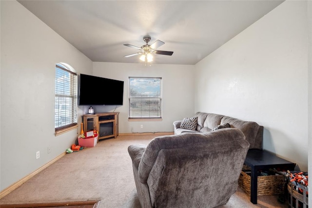 living room with ceiling fan and light colored carpet