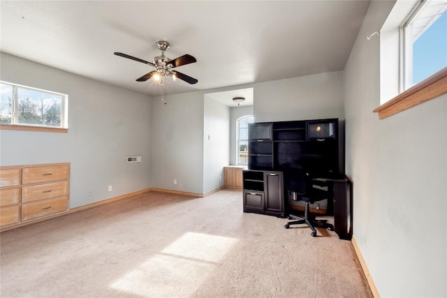 office area featuring ceiling fan and light carpet