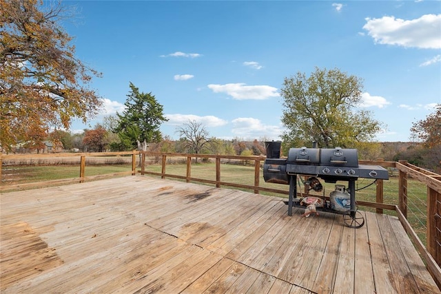 deck featuring a grill and a rural view