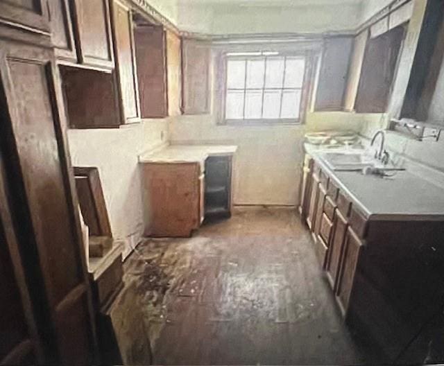 kitchen with dark brown cabinets and sink