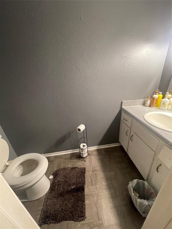 bathroom with vanity and toilet