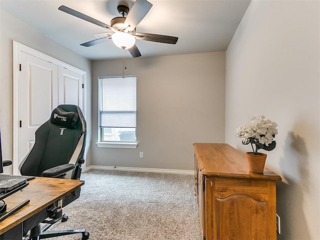 office area featuring ceiling fan and light colored carpet