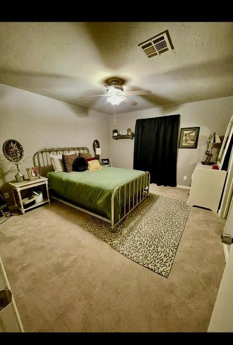 bedroom featuring carpet floors and ceiling fan