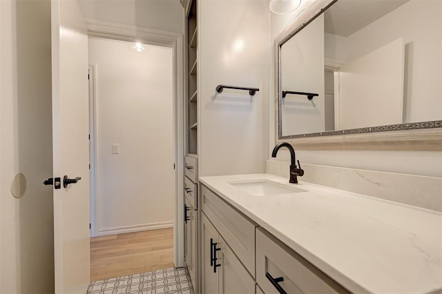 bathroom featuring vanity and hardwood / wood-style flooring