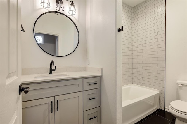 full bathroom with tile patterned floors, vanity, toilet, and tiled shower / bath