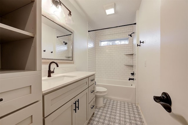 full bathroom featuring vanity, toilet, and tiled shower / bath