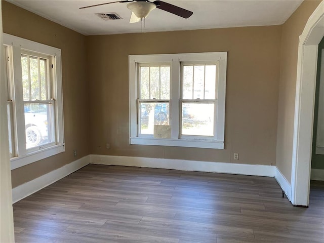 spare room featuring ceiling fan and wood-type flooring