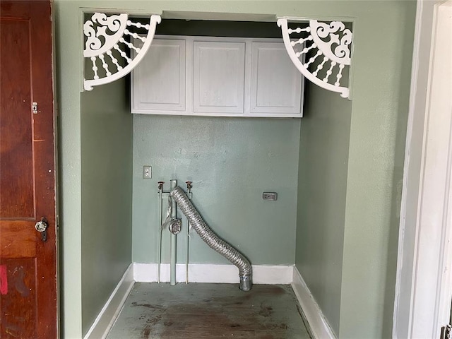 washroom featuring cabinets, hookup for a washing machine, and electric dryer hookup