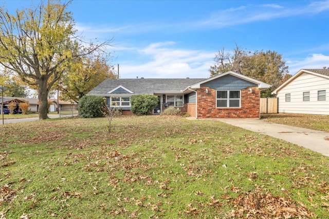 ranch-style home featuring a front yard