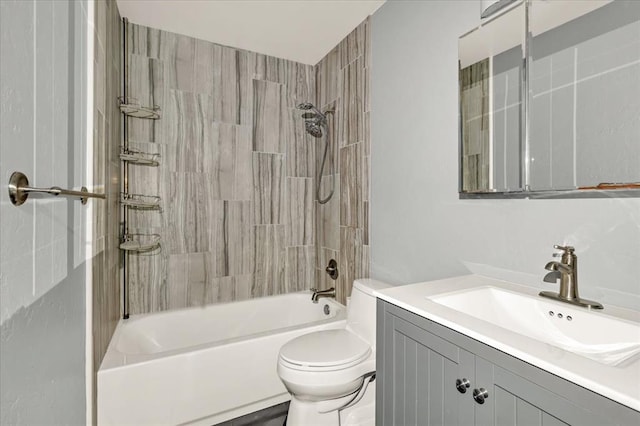 full bathroom with vanity, toilet, and tiled shower / bath