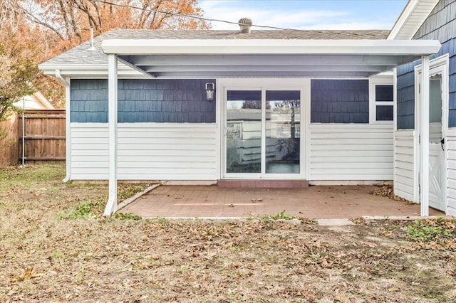 entrance to property with a patio