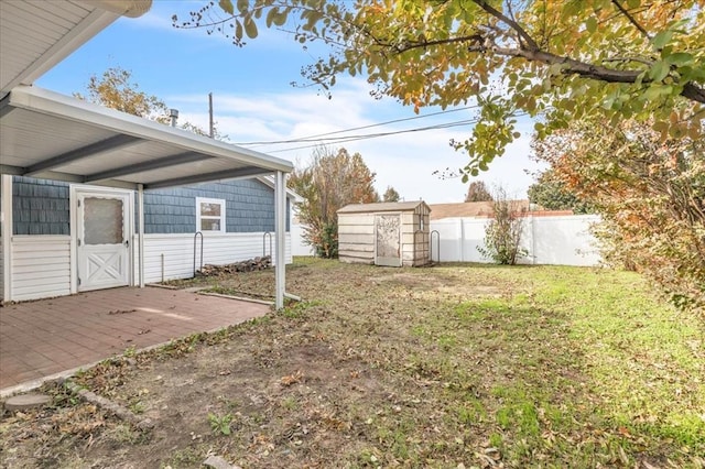 view of yard with a wooden deck and a shed